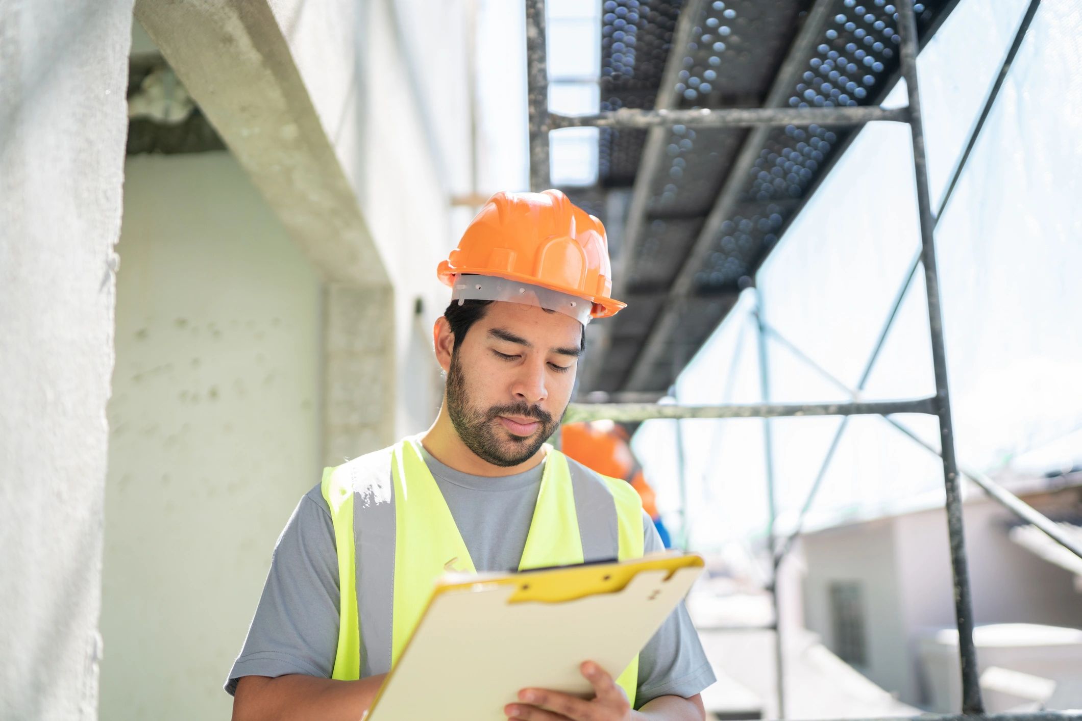 Engineer with clipboard on a job site