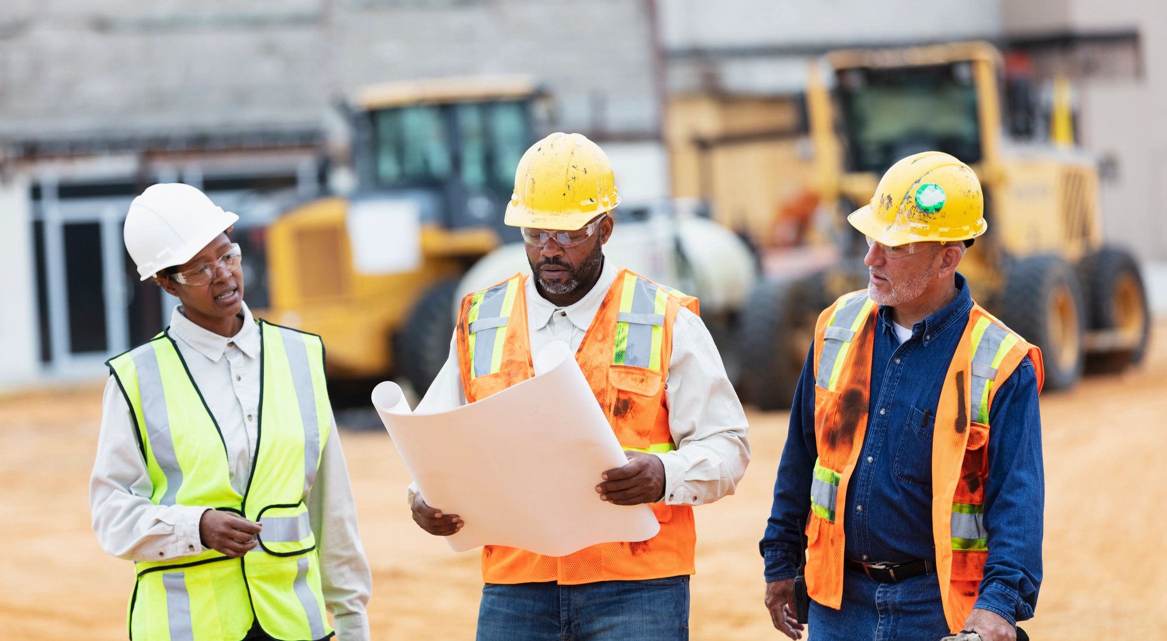 Construction workers talking at a job site