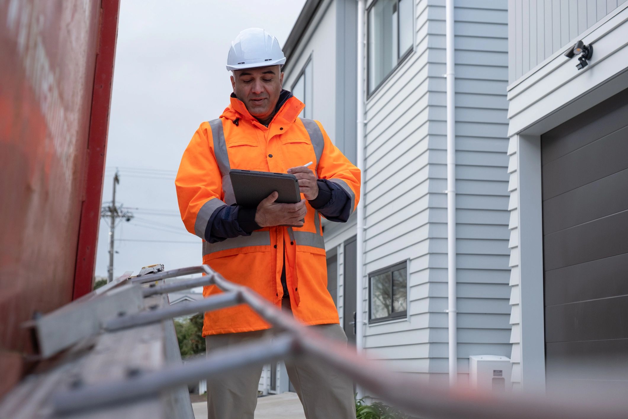 Site manager reviewing reports on a construction site