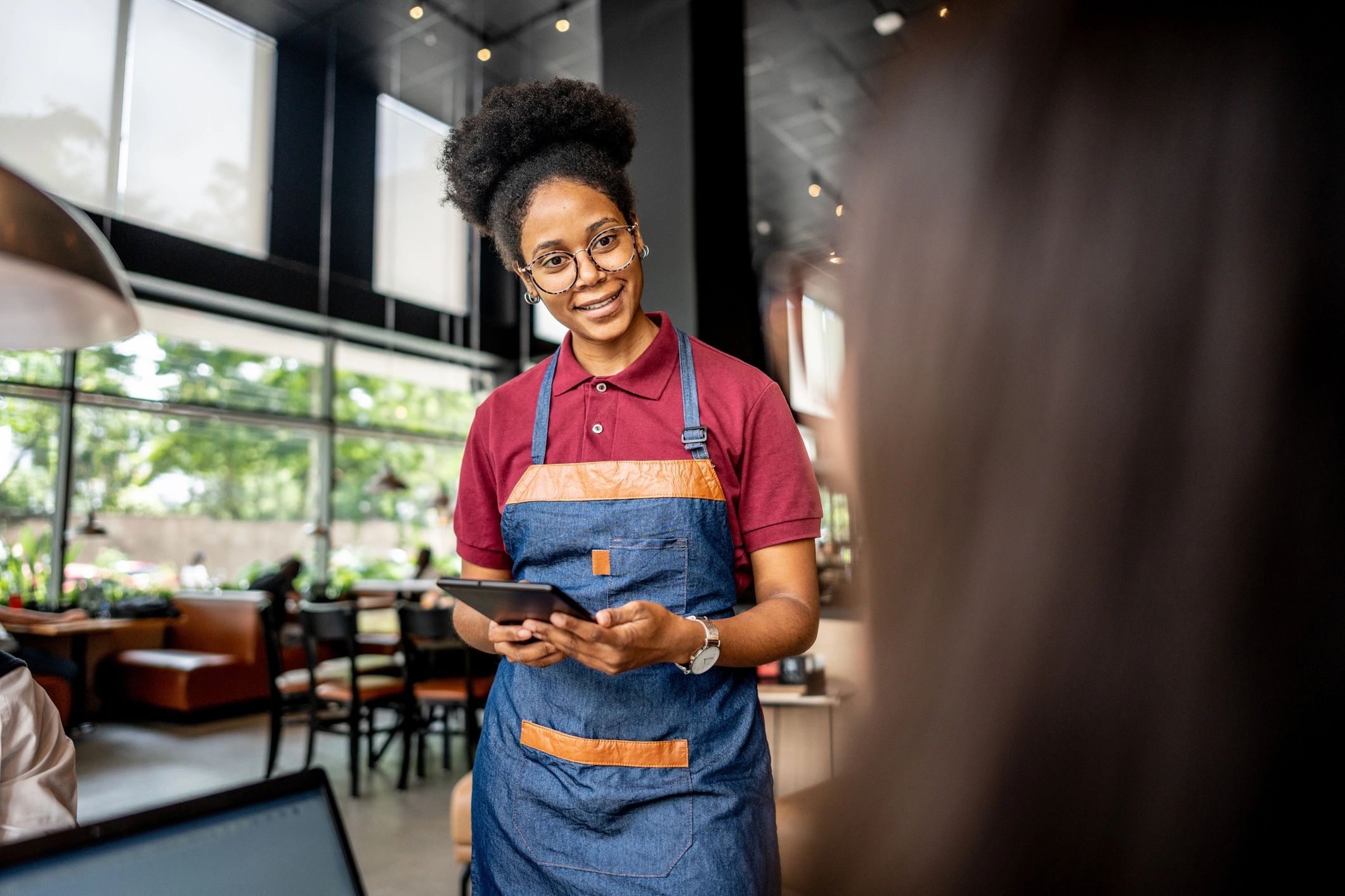 Restaurant server taking an order at a table