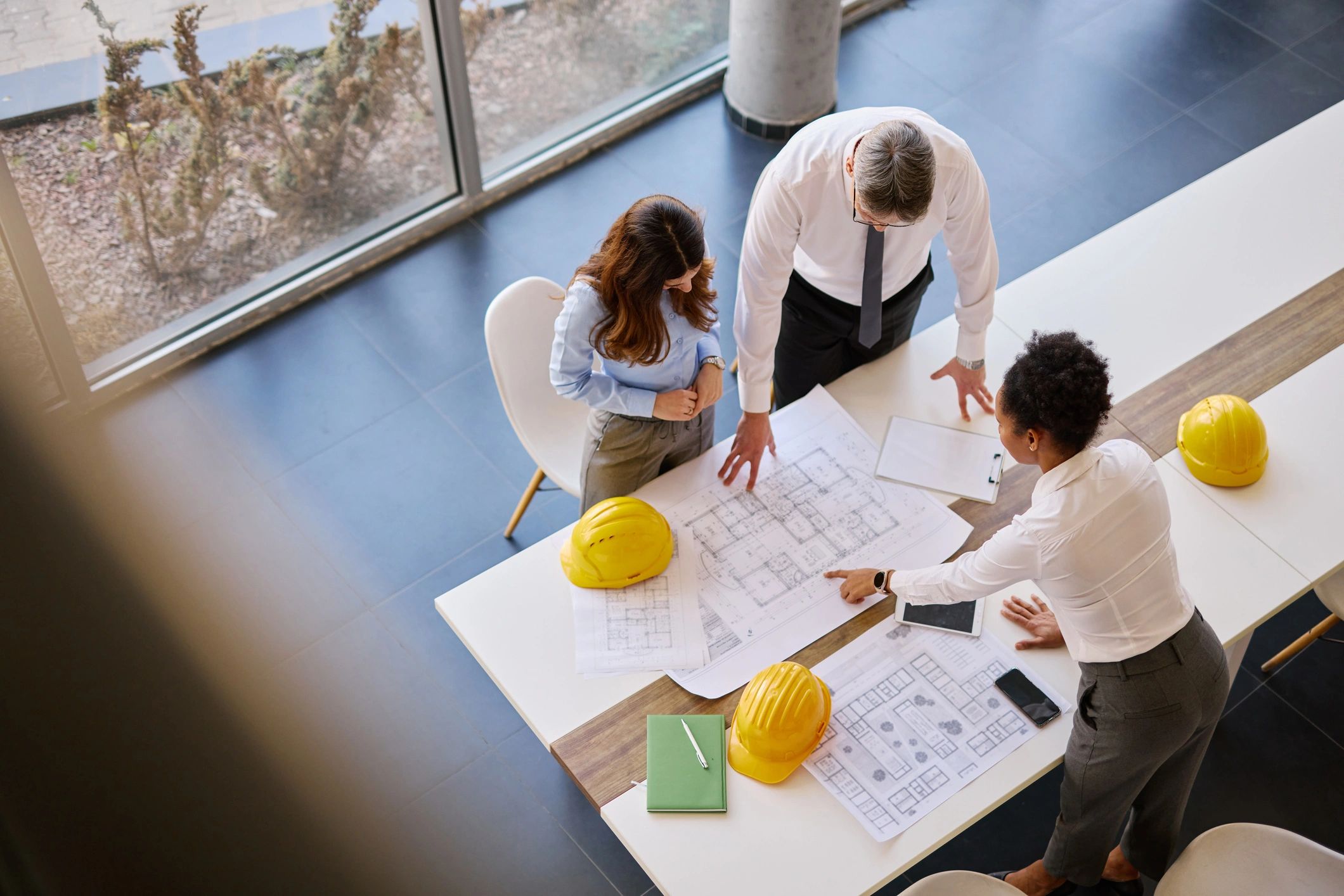 Team reviewing construction plans at a table
