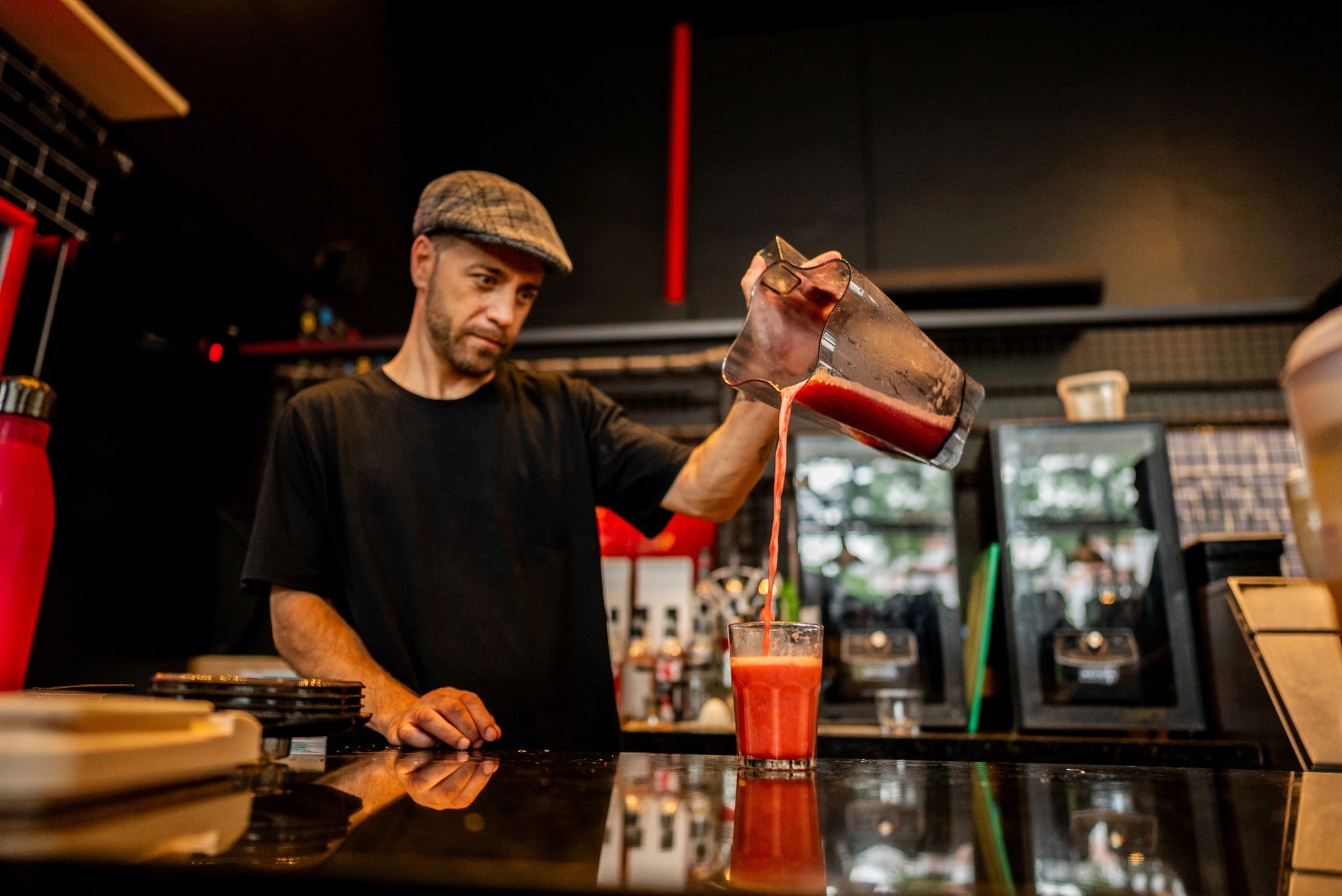 Bartender preparing a drink at a bar