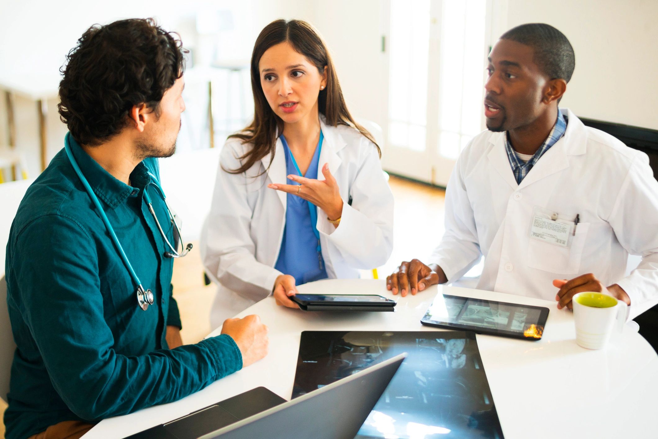 Doctors meeting and reviewing information together