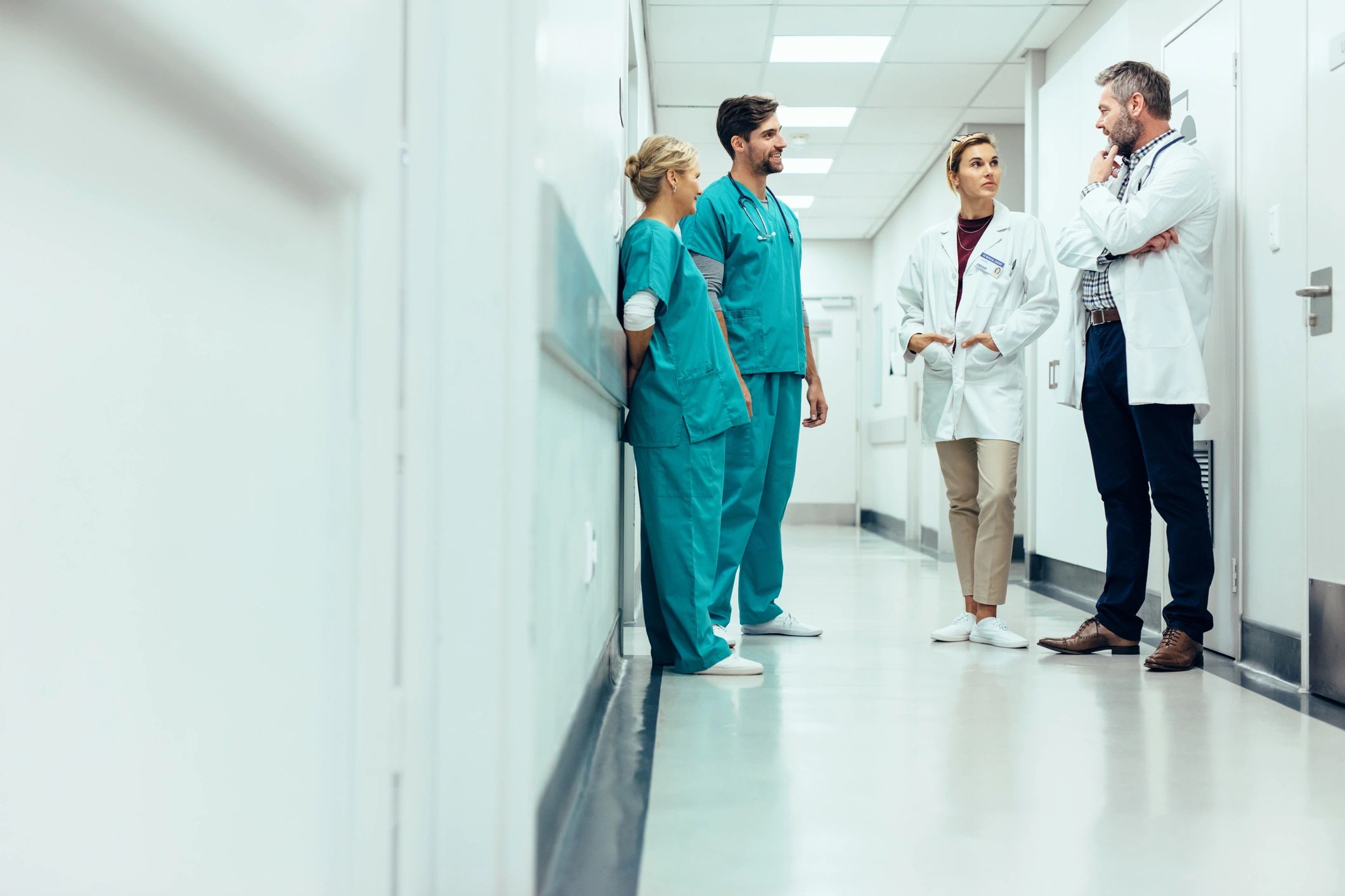 Healthcare professionals collaborating in a hospital corridor